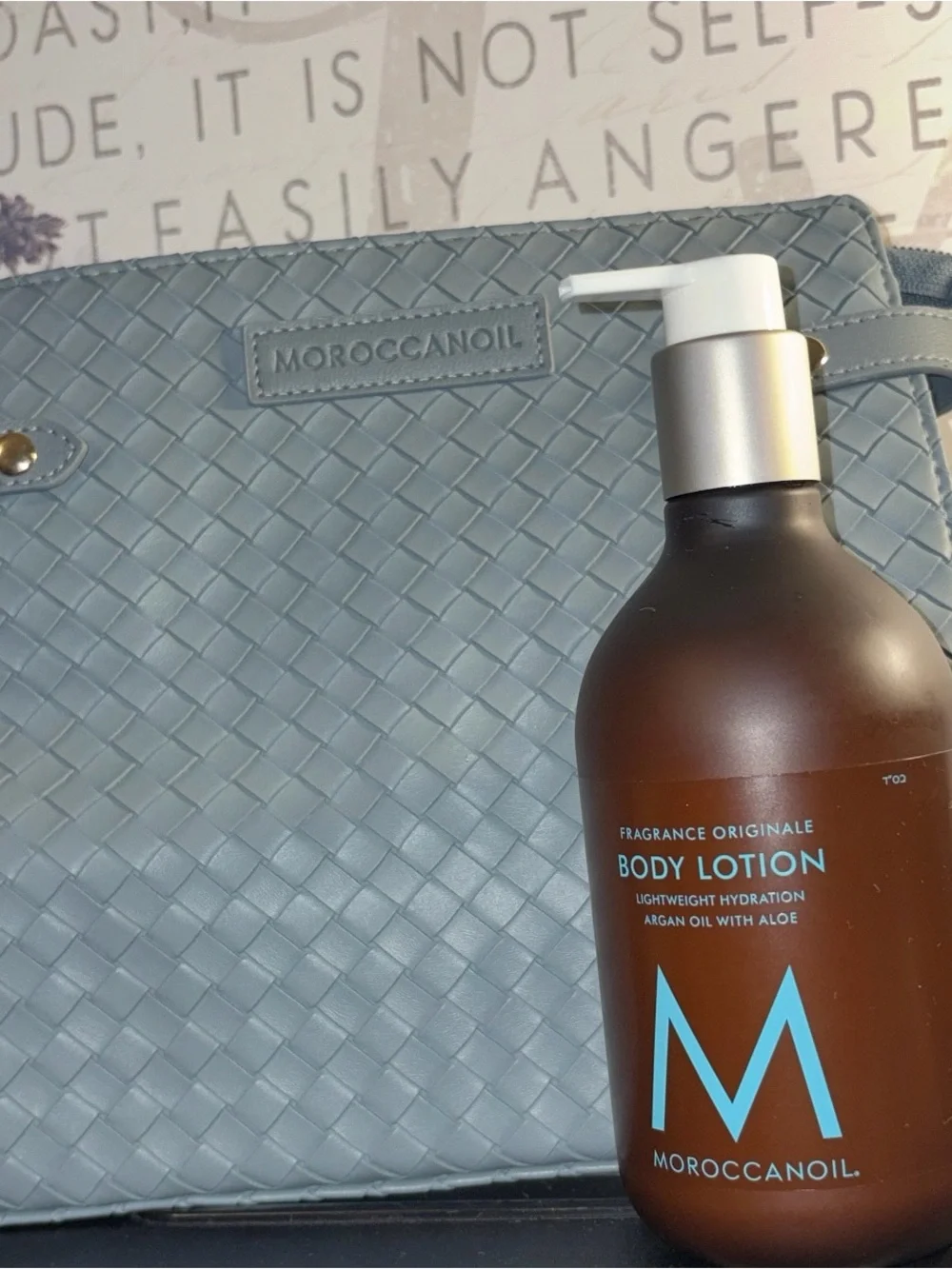 Moroccanoil Light Blue Woven Cosmetic Case & Bottle Body Lotion with M Logo.